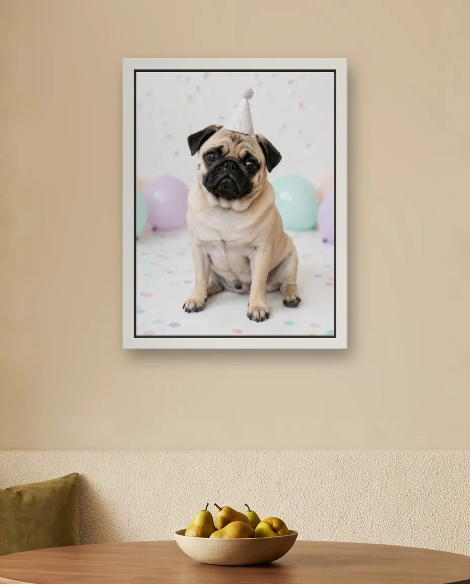 A pug's Birthday Party portrait as a framed canvas on a dining corner wall above a cream banquette