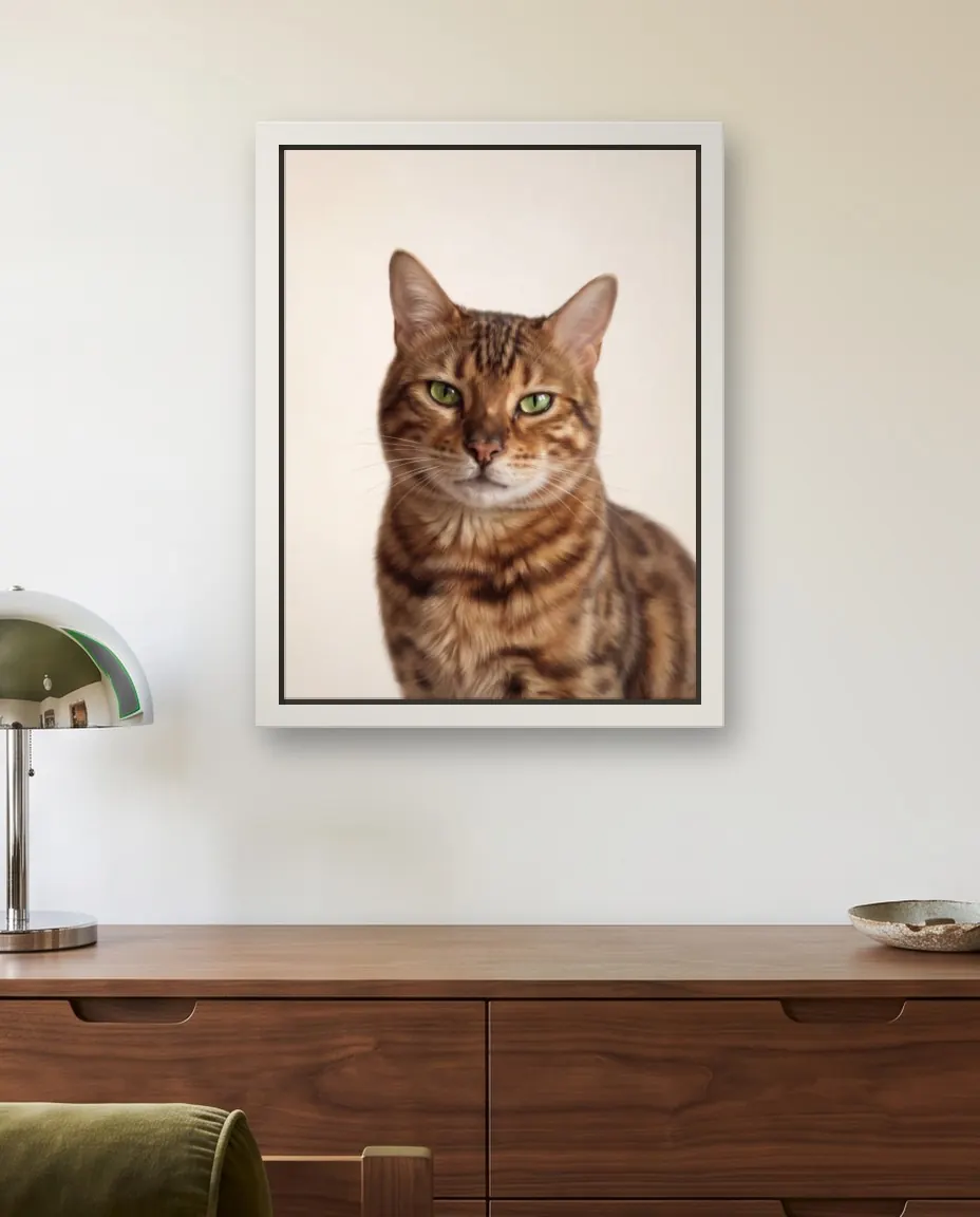 Prada's Clean Studio portrait as a framed canvas on a bedroom wall above a walnut chest of drawers